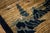 This antique rug is a classic Chinese Peking piece from circa 1920, featuring a refined and understated color palette. The...