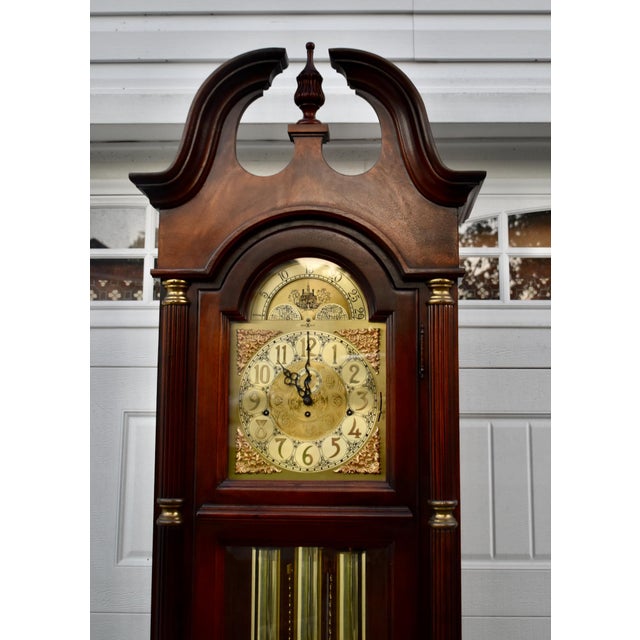 Vintage (1980's) Grandfathers Clock has a Traditional Style. Made by Howard Miller. The Wood is Mahogany. The Clock has...