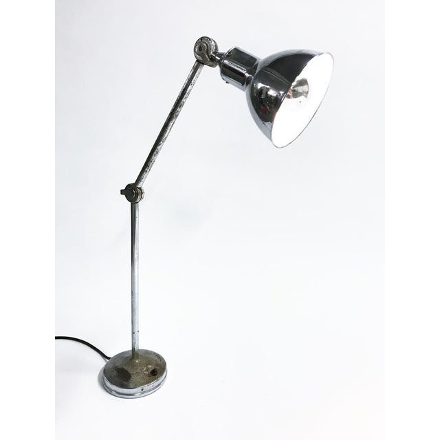 Industrial Chrome Plated Table Lamp from AGI, 1930s, in Worn conditions. Designed 1920 to 1949 This piece is attributed to...