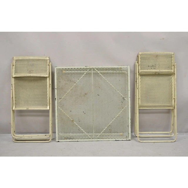 Vintage Mid Century Modern Wrought Iron Folding Card Game Table Set - 5 Pcs. Set includes 4 folding chairs with pivoting...