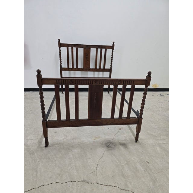 Classic style bedframe, with sturdy steel rails. Barley Twist turned corner posts with carved floral reliefs along the...