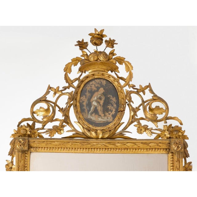 French, 18th c. Carved and gilt wood, verre églomisé and mirror plate. Over-all in fine original condition. Provenance:...