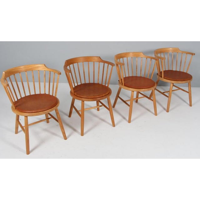 Børge Mogensen arm chairs / pub chairs in ash. Cushions of patinated leather. Model 3249, made by Fredericia Furniture....