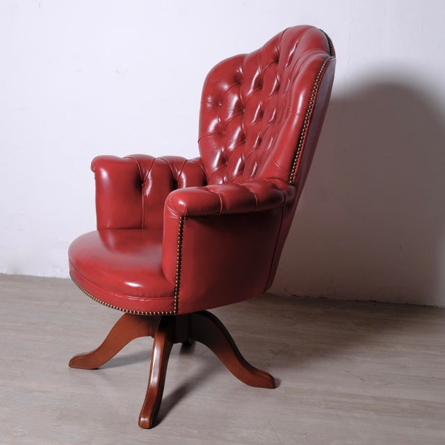 Chesterfield swivel office chair. Comfortable executive chair supported by a solid wooden frame Tufted backrest. Faux...