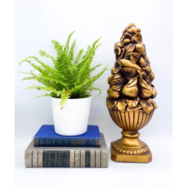 Stunning, gold painted plaster topiary from the mid-late 20th century. Gorgeous assortment of fruit on a pedestal makes...