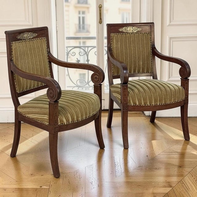 Elegant in both form and proportion, this exceptional pair of French Empire Period fauteuils embodies the refined...
