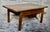 Antique French chestnut occasional/coffee table. Made from Chestnut, with a planked finish to the top. C1900 This table...
