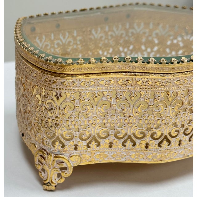 This detailed brass jewelry casket has beautiful detail, and there's velvet lining on the inside. This could be used for...