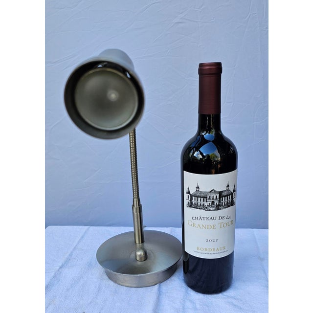 Offering a very nice vintage brushed stainless steel gooseneck table lamp with dimmer marked 'Levenger Well-Read Life'....