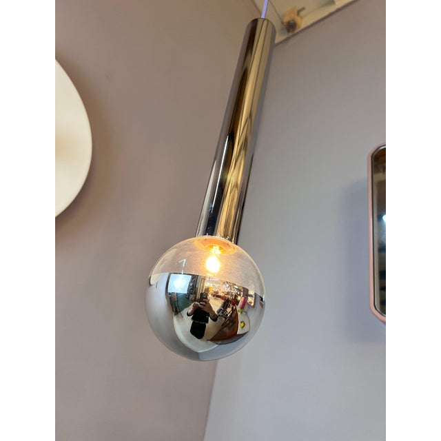 The big globe hanging lamp cm is a renowned design object by motoko ishii for staff. The elegant cylindrical housing made...