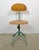 This industrial height adjustable, rotating chair was made in former Czechoslovakia during the 1950s.It features a dark...