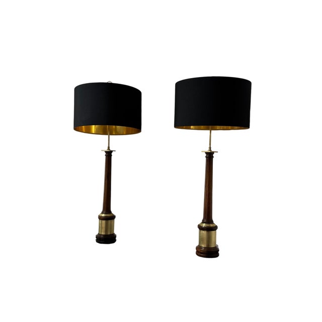 Set of 2 fine Hollywood Regency table or cabinet lamps, England, 1970s. Solid mahogany fluted neck set on cylindrical base...