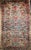 This elegant vintage Persian Kerman Lavar rug from the early 1900s features a harmonious all-over floral bouquet pattern,...