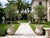 Off-white Pair of Vintage Faux-Stone Chipped Resin Garden Planters For Sale - Image 8 of 12