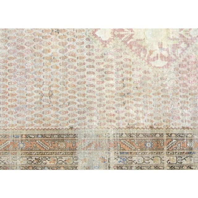 This semi-antique Melayer rug represents the distinguished weaving heritage of Iran's Hamadan region, measuring 7'1" x...