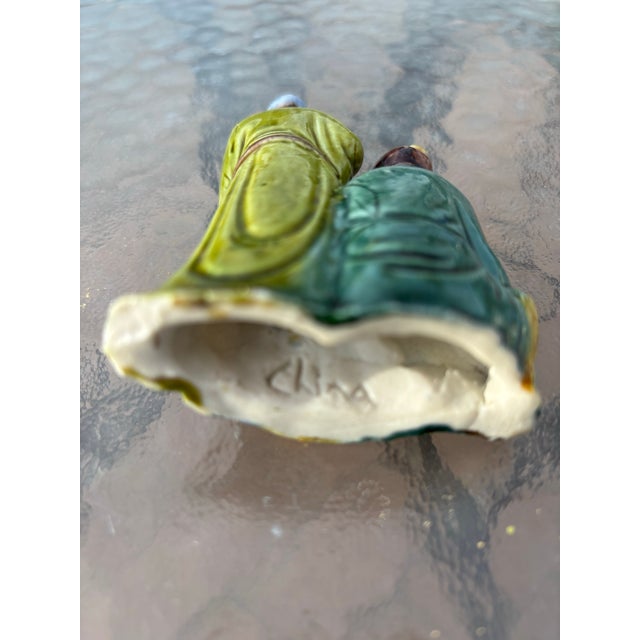 This is a Chinese figurine of a Mud-man and a Mud-woman marked China circa 1890-1910. This is a more rare figurine because...