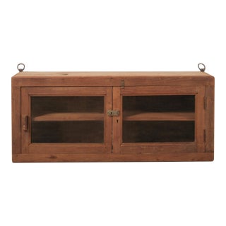 Late 20th Century Indian Teak Wood Wall Cabinet With Glass Doors and Original Hardware For Sale