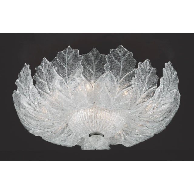 Italian flush mount with clear Murano glass leaves hand blown in Graniglia technique to produce a granular textured effect...