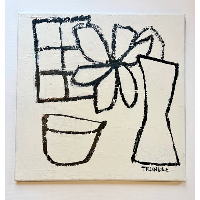 Simple still life in black acrylic paint stick on a well texture, warm creamy white back ground. Edges painted the same...