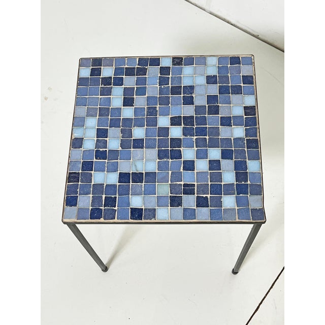 A pair of Italian side tables with Murano glass inset tiles. This design is often associated with the American importer...