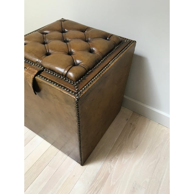 Handsome, English storage box from the 1920s. Top is reversible - one side is tufted, the other is flat - making it...