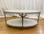 Bernhardt Morello cocktail table featuring a faux Carrara marble top and steel frame in a nickel finish. This oval-shaped...