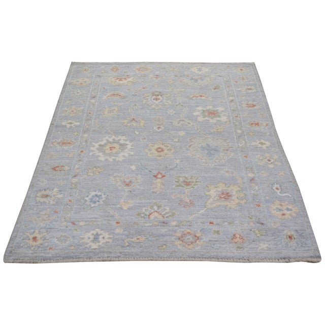 Hand-knotted with care using traditional rug making techniques, this wool rug blends timeless craftsmanship with a modern...