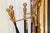 A vintage six piece brass and wrought iron fireplace tool set consisting of a rack with a damper opener, tong, brush,...