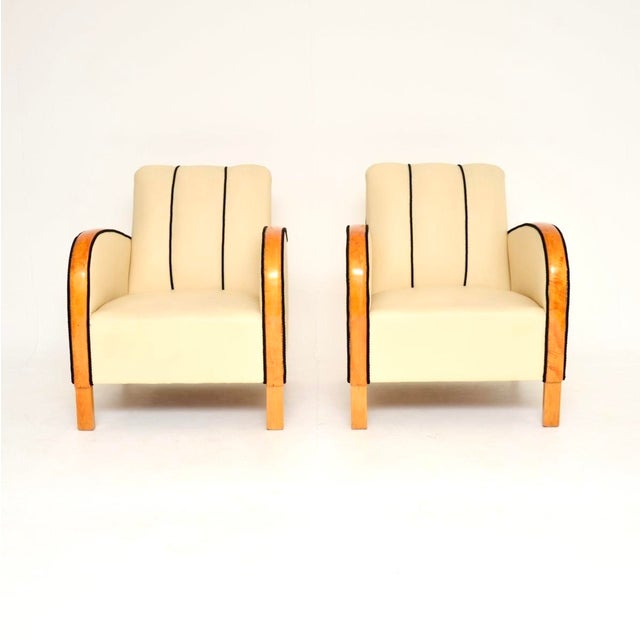 A stylish and very well made pair of Swedish Art Deco armchairs in leather and satin birch. They were recently imported...