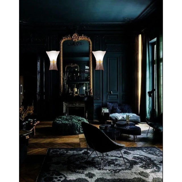 Stunning pair of Murano glass sconces. Italy, 1970's. The wall lights are fitted with an e27 light fitting, european...