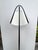 Stylish Currey & Co Frey Black Floor Lamp. Black arched body, black base. White tapered shade. Original Retail $1340....