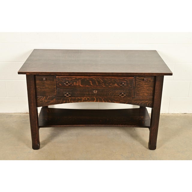 An exceptional antique Mission or Arts & Crafts period writing desk or library table with unique file drawers In the...