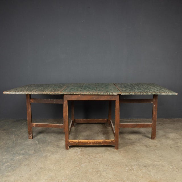 Antique early-20th Century American pine gatelegged table, has its original decoration, hand painted at the turn of the...