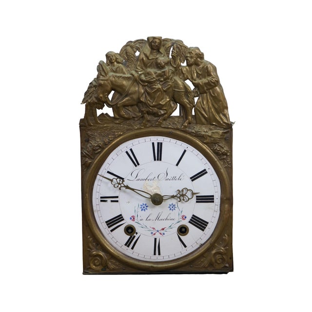 Antique 19th century French Comtoise / Morbier clock movement with embossed brass pediment featuring a scene of the Flight...