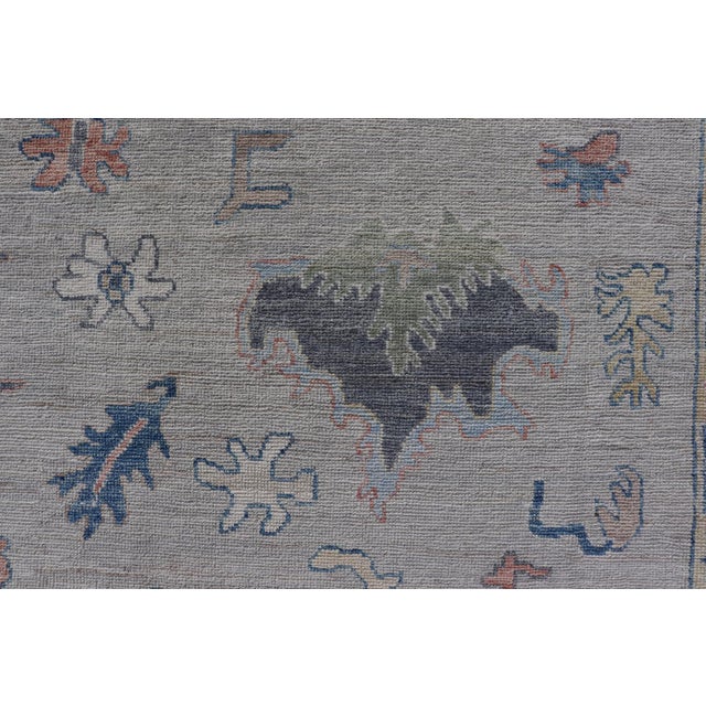 Modern Oushak Rug With Slate Blue Border and Colorful All-Over Tribal Motifs For Sale - Image 12 of 15