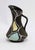 A charming handled pitcher vase in the "Trinidad" decor, designed by Bodo Mans for Bay Keramik, West Germany. Model...