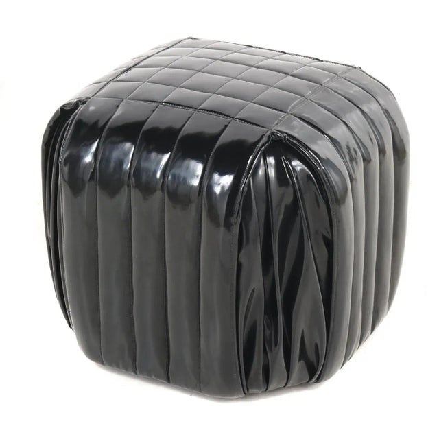 The Minimalist Italian design. Wrapped in black patent leather stools or poufs on wood feet. Quilted with a modern square...