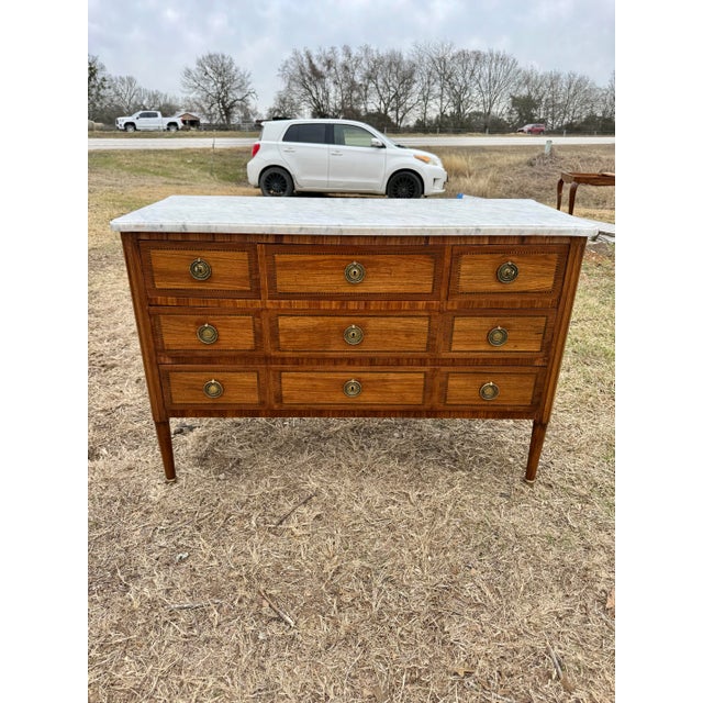 19th Century French Louis XVI Commode from Paris France. Made of solid mahogany, with a Carrara marble top, the wood has...