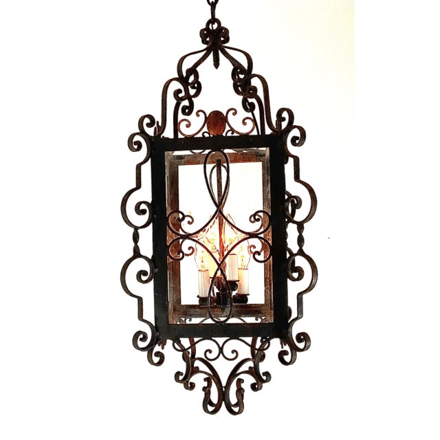 levate any interior with this striking vintage wrought iron lantern, richly detailed with ornate hand-forged scrollwork....