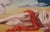 The artwork depicts a surreal landscape where a reclining figure, draped in a vivid red cloth, lies on a barren terrain,...
