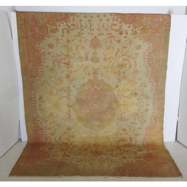 Beautiful soft shades of salmon, cream and gold with a hint of green decorate this stunning rug. Vegetable dyes have...