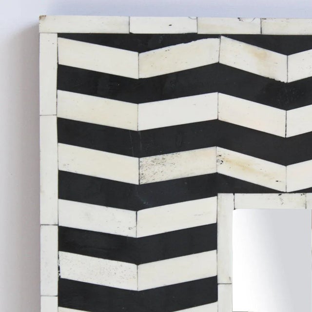 Zig zag hand-cut pattern with in classic black and white / off-white. This full-length mirror is eclectic yet classic....