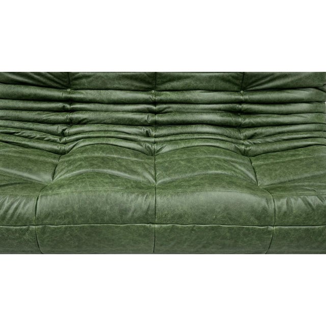 French Three-Seater Togo Sofa in Forest Green Leather by Michel Ducaroy for Ligne Roset., in Restored conditions. Designed...