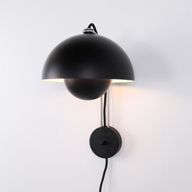 Flowerpot vp8 wall lamp in black by verner panton for &tradition. Iconic danish lighting with the classic dual-shade...
