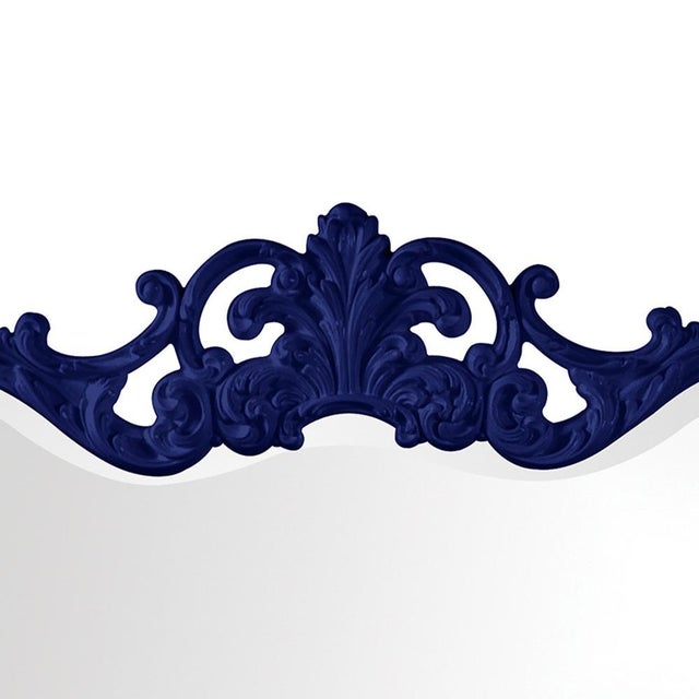 The Talida Mirror is a lovely piece featuring an ornate, textured frame adorned with decorative flourishes. The entire...