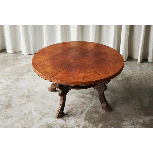 Mid-Century Coffee Table in Solid Wood and Patinated Cognac Leather. This incredible Mid-Century coffee table was well...