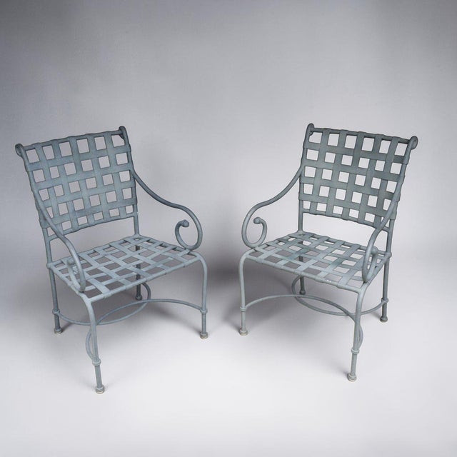 Vintage Brown Jordan Florentine patio set consisting of two cast aluminum armchairs and a matching round table. The...