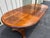 Double pedestal oak extension dining table. Includes two 18” leaves and can expand from a 52”circular shape to 88” oval...