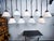 Beautiful early Dutch etched and opaline pendant lights by Philips. Constructed out of glass with brass fixtures and...