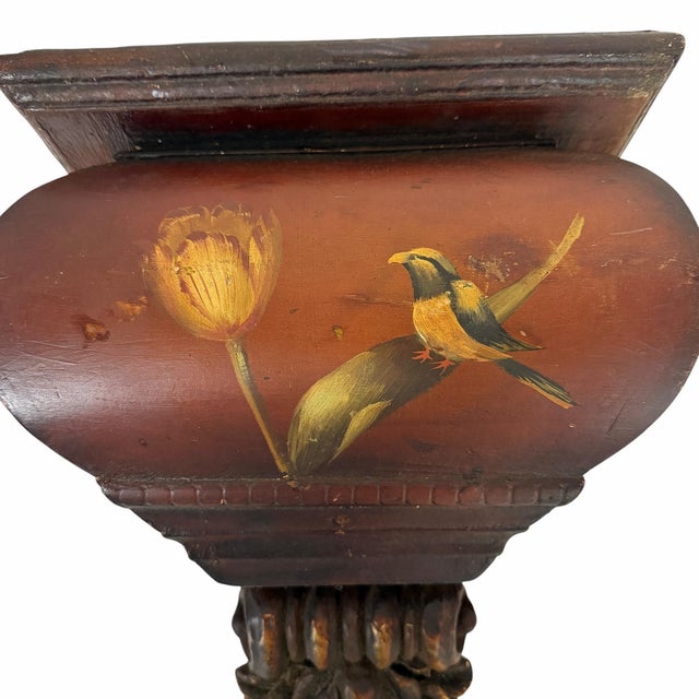 This hand-painted wooden wall shelf features a traditional bird and flower design on a dark brown finish.It appears...